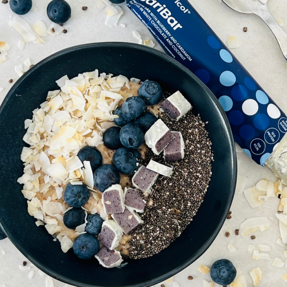 Overnight oats with chia, blueberries, coconut, and protein bar